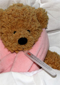 "Kranker" Teddy mit Schal und Fieberthermometer